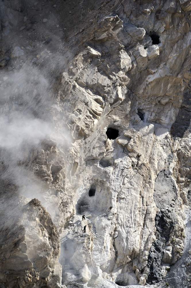 Miners of the &#39;Maidan&#39; mine got out of a hole in the rock after having set off a series of explosions in order to find lapis lazuli, a semi-precious stone exploited for 6500 years in the northeast region of Afghanistan. Credit: Philip Poupin