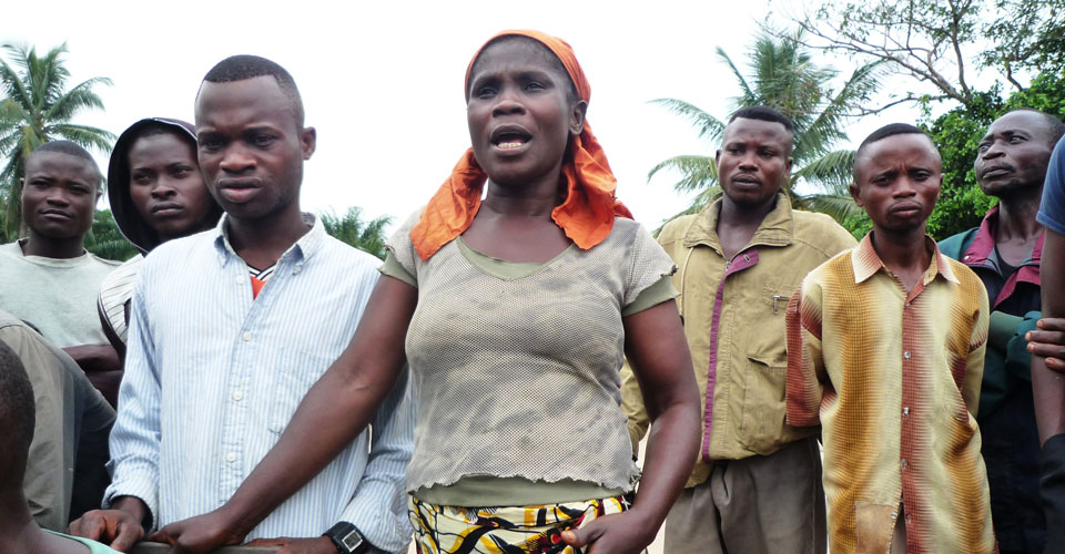 woman at meeting in DRC